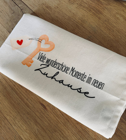 Geschirrtuch „Viele wunderschöne Momente im neuen Zuhause“ – stilvolles Einzugsgeschenk aus Baumwolle